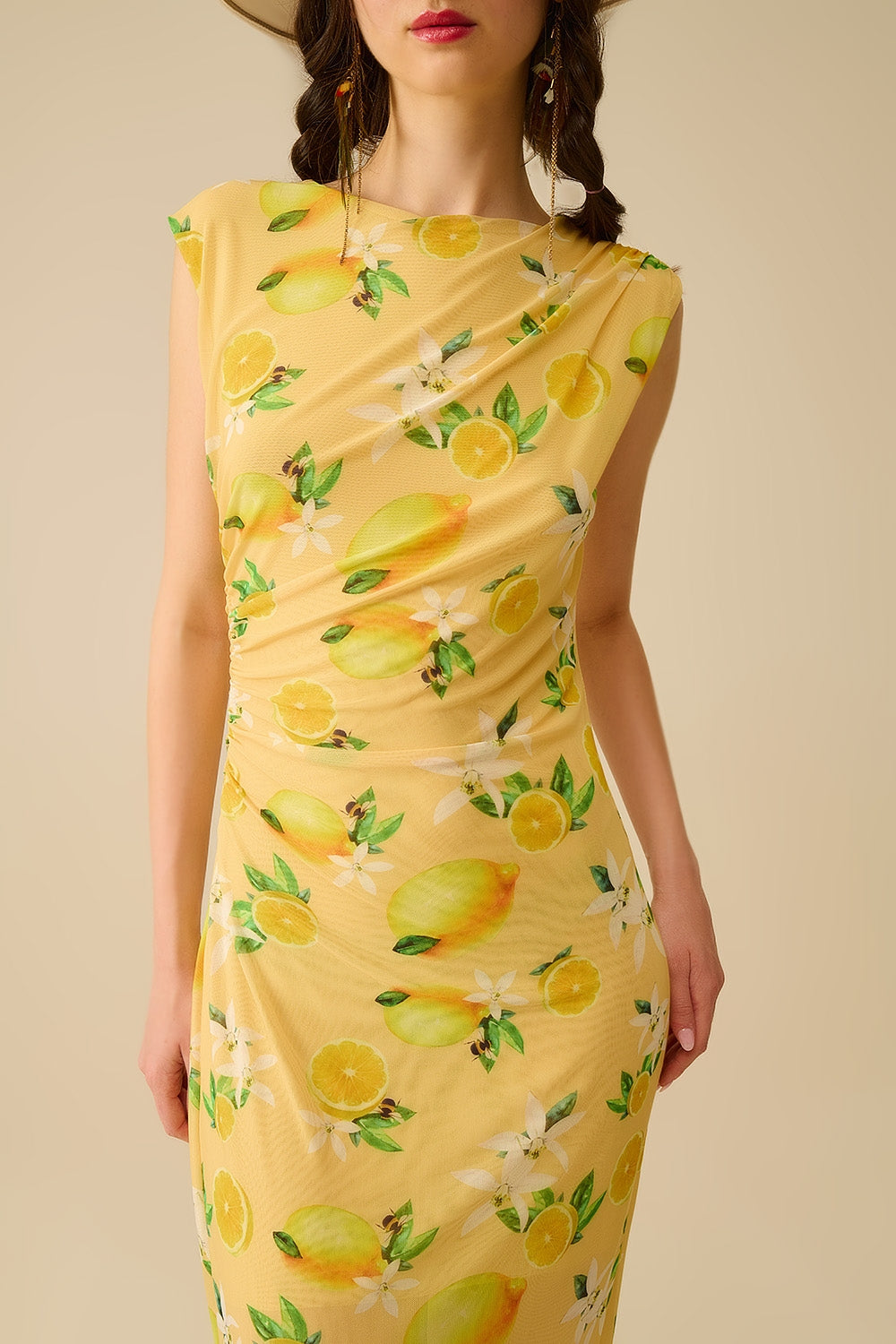 Abito in tulle con balza laterale con stampa giallo limone