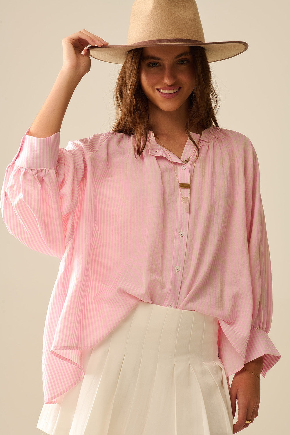 Blusa a righe con maniche a palloncino in rosa