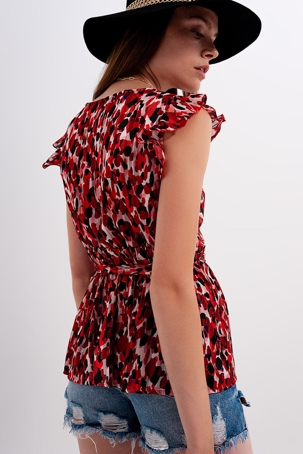 Blusa chiffon con volant animalier