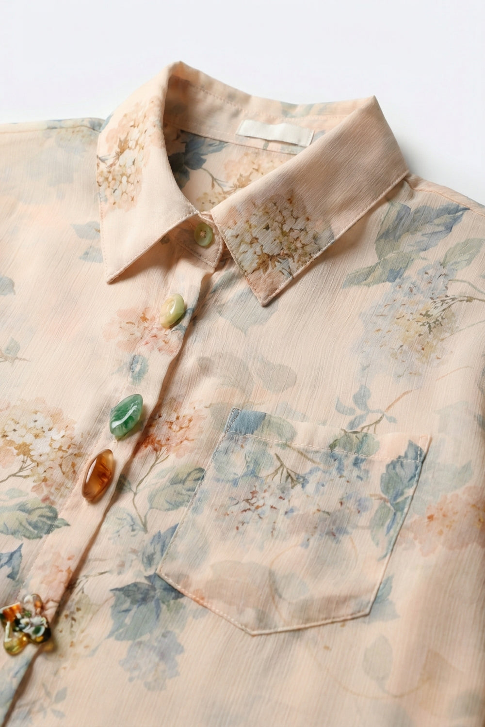 Camicetta beige con stampa floreale e bottoni