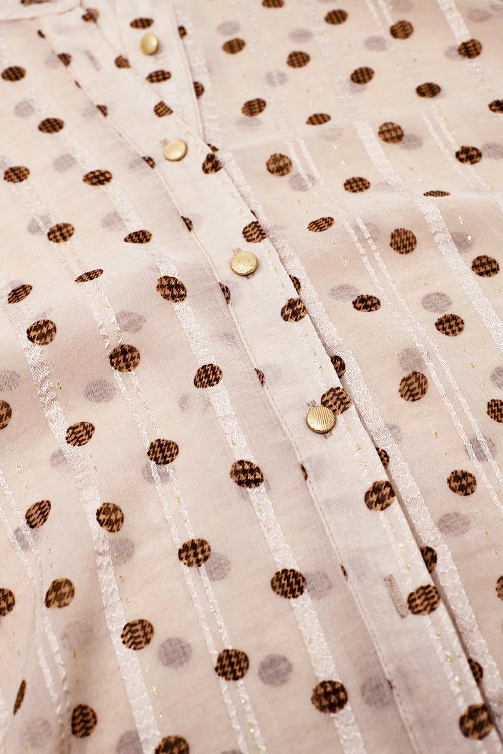 Camicetta con maniche a palloncino e pois di colore beige