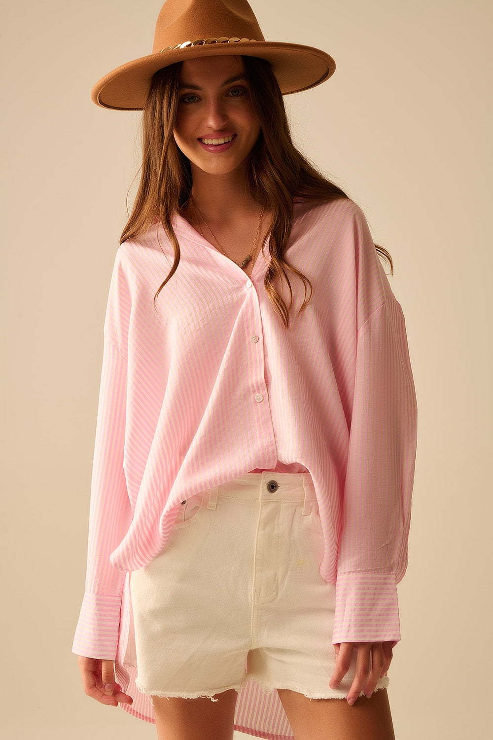 camicia oversize rosa baby con fiocco sul retro