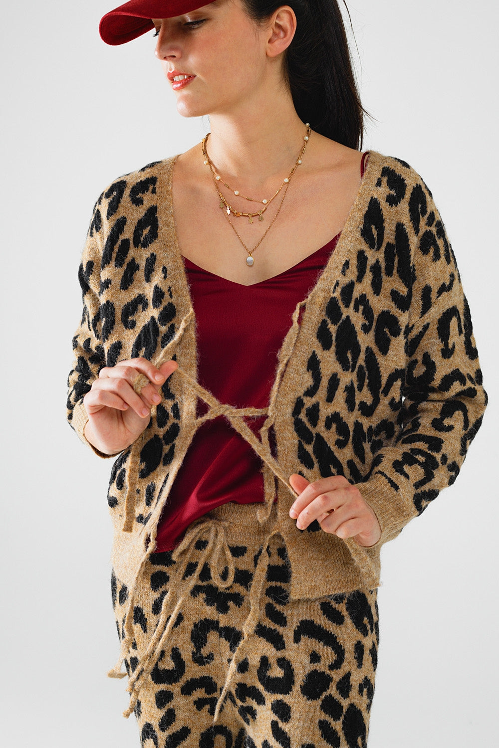 Cardigan a maniche lunghe con stampa leopardo e dettagli con fiocchi