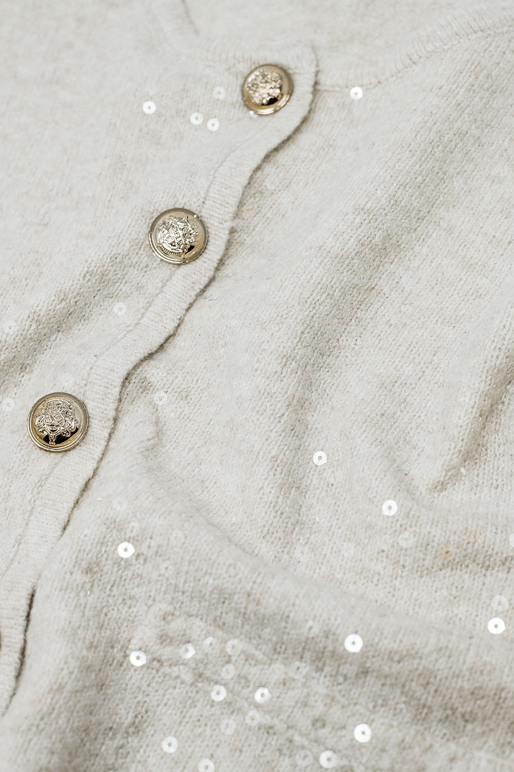 cardigan bianco in maglia grossa con paillettes