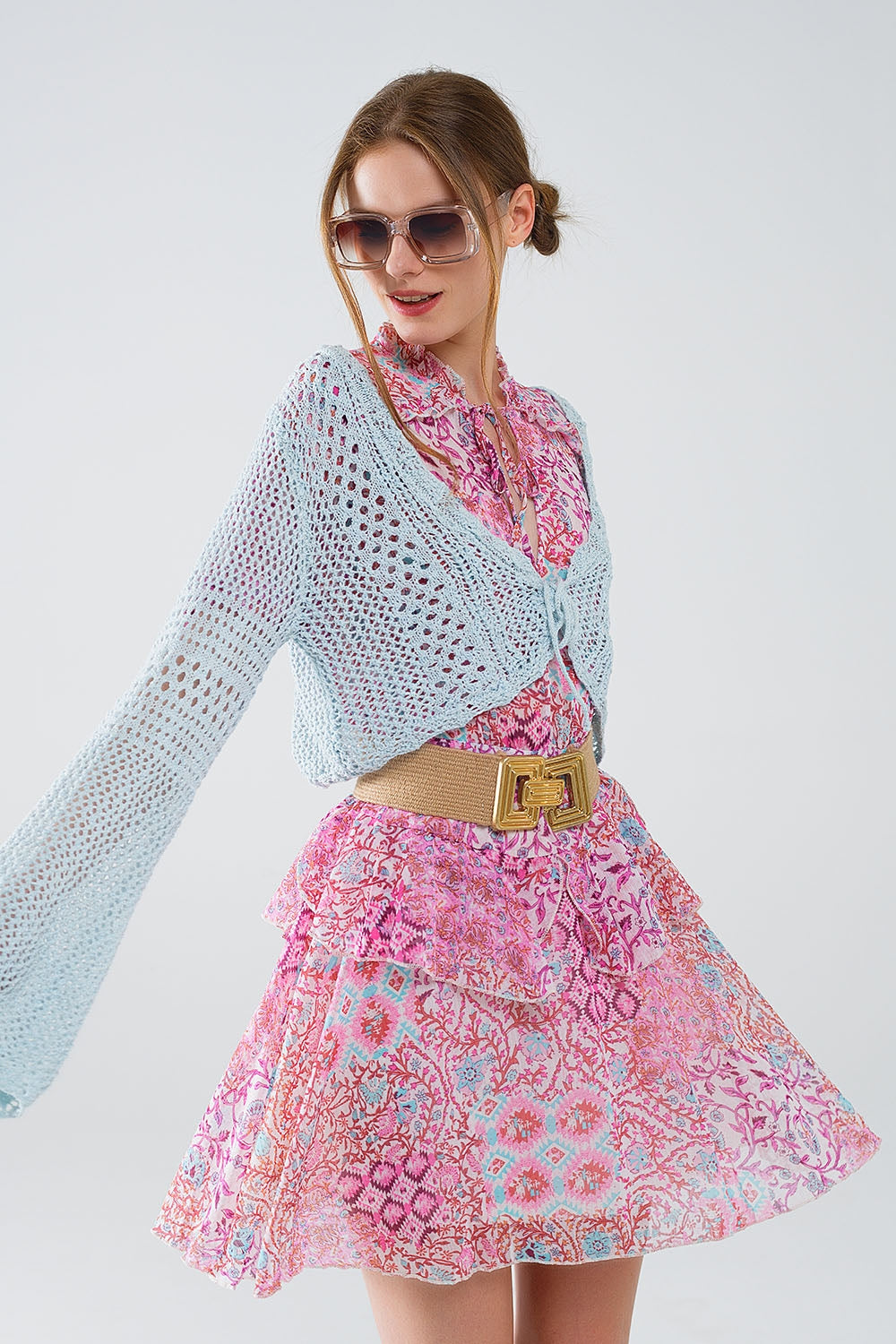 Cardigan cropped in blu baby con chiusura a cravatta