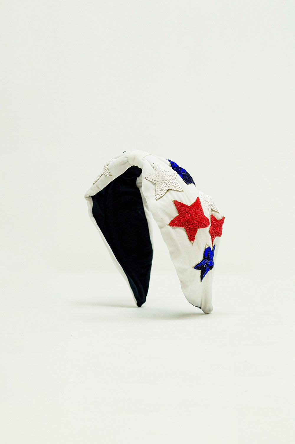 Cerchietto con stelle a paillettes in bianco