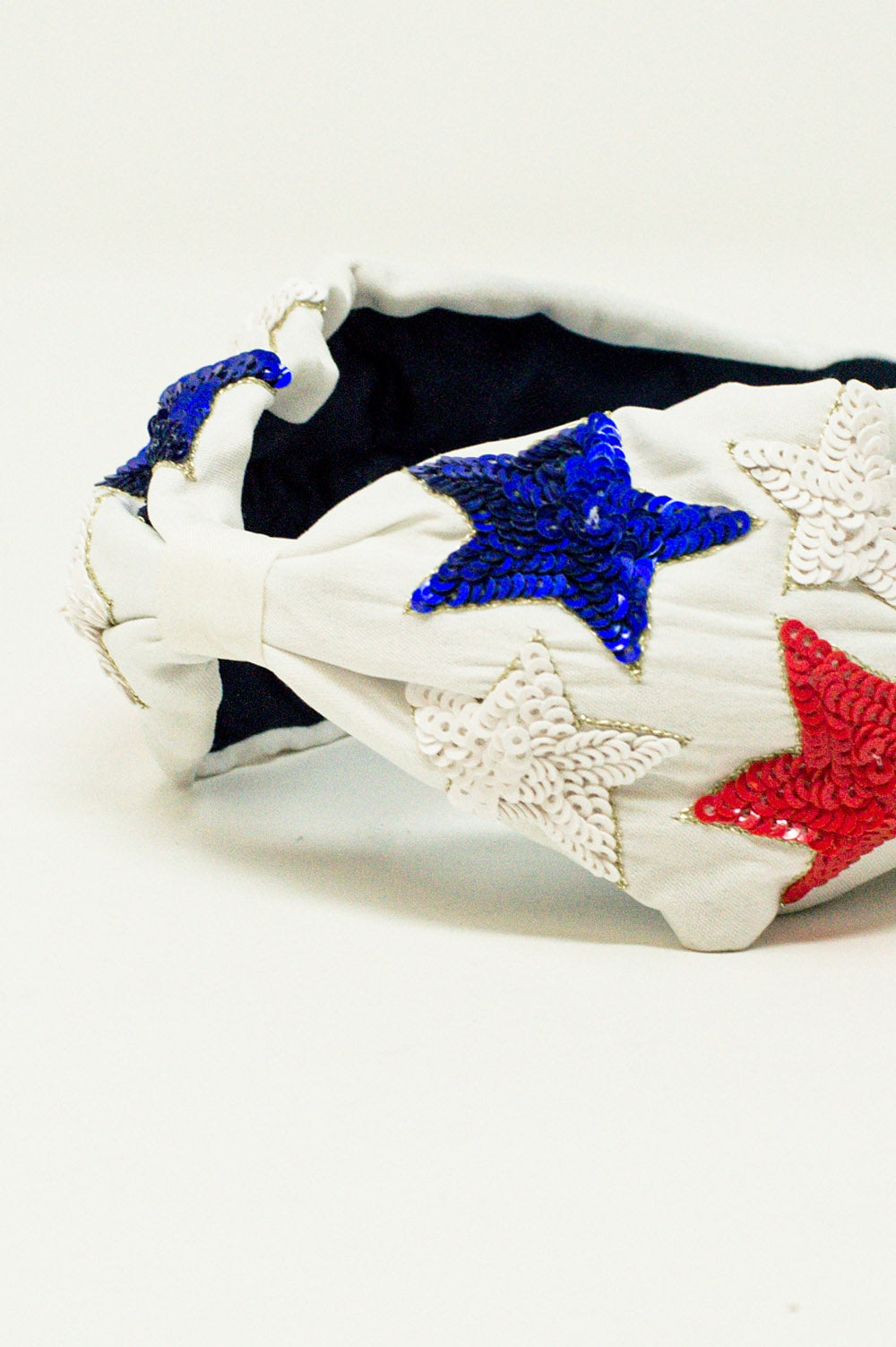 Cerchietto con stelle a paillettes in bianco