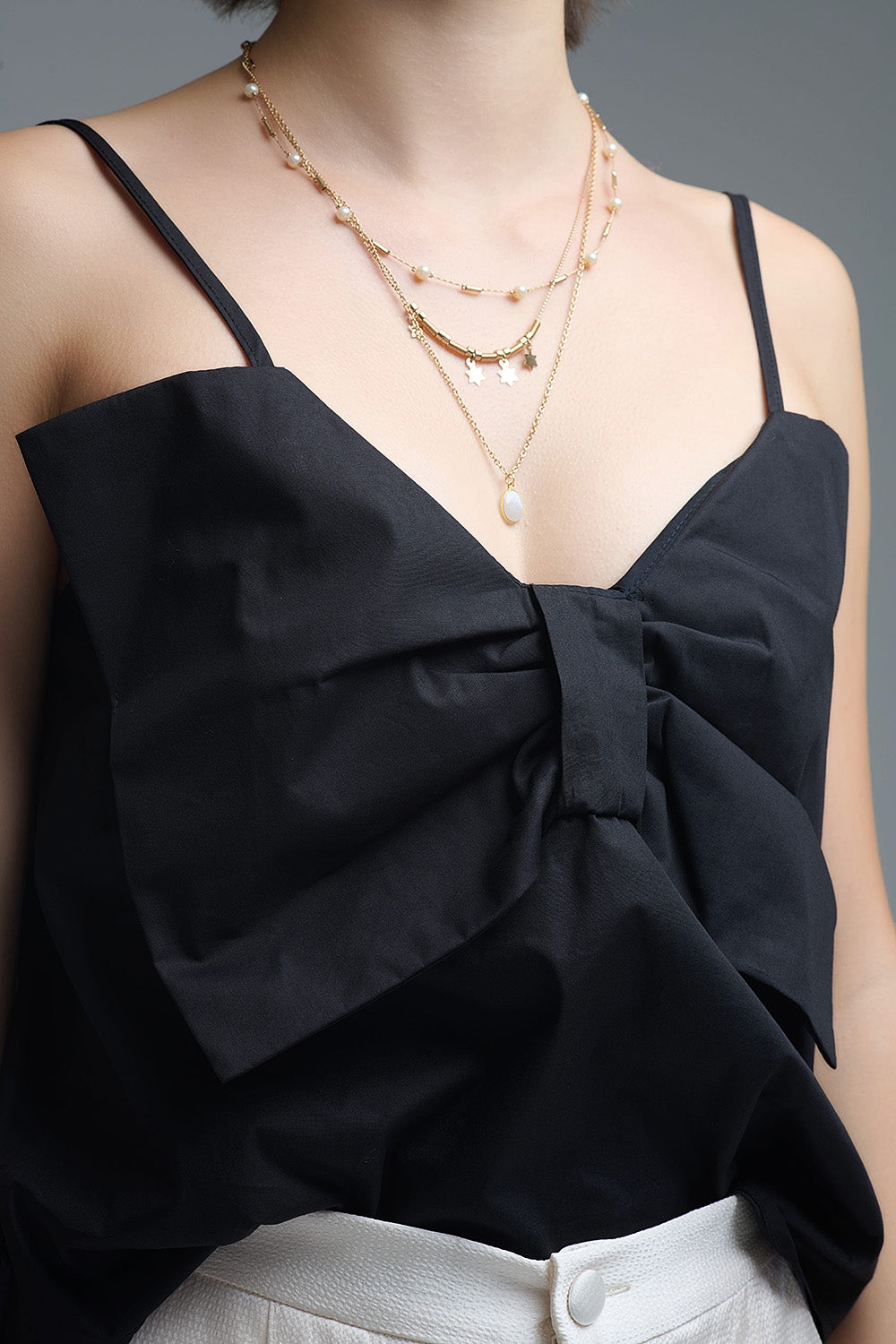 Crop top in popeline nero con fiocco
