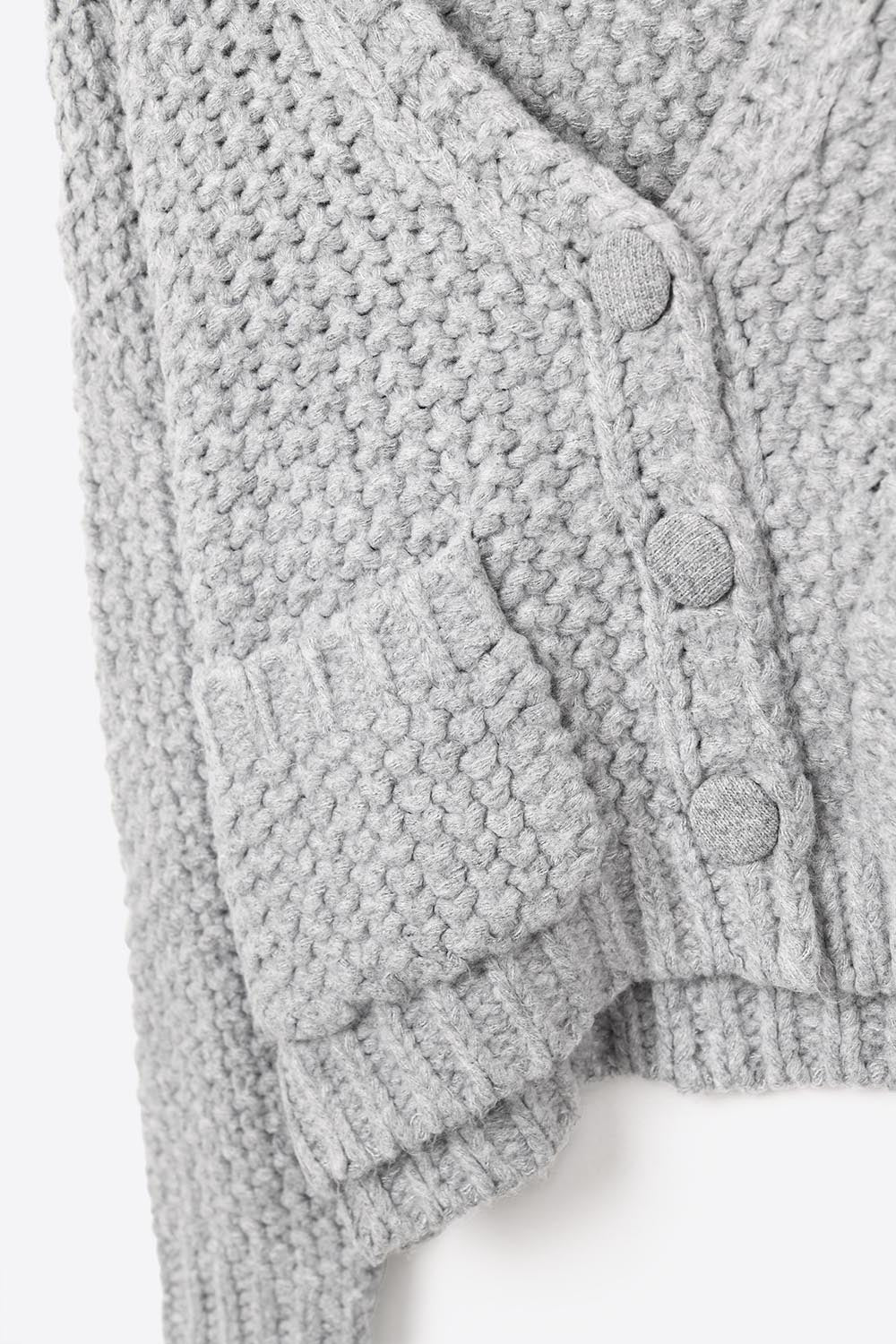 Giacca oversize grigia in maglia grossa con tasche