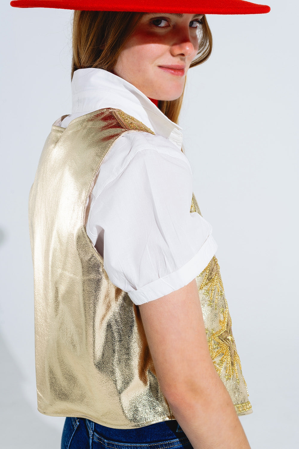 Gilet aperto con stelle ricamate in oro