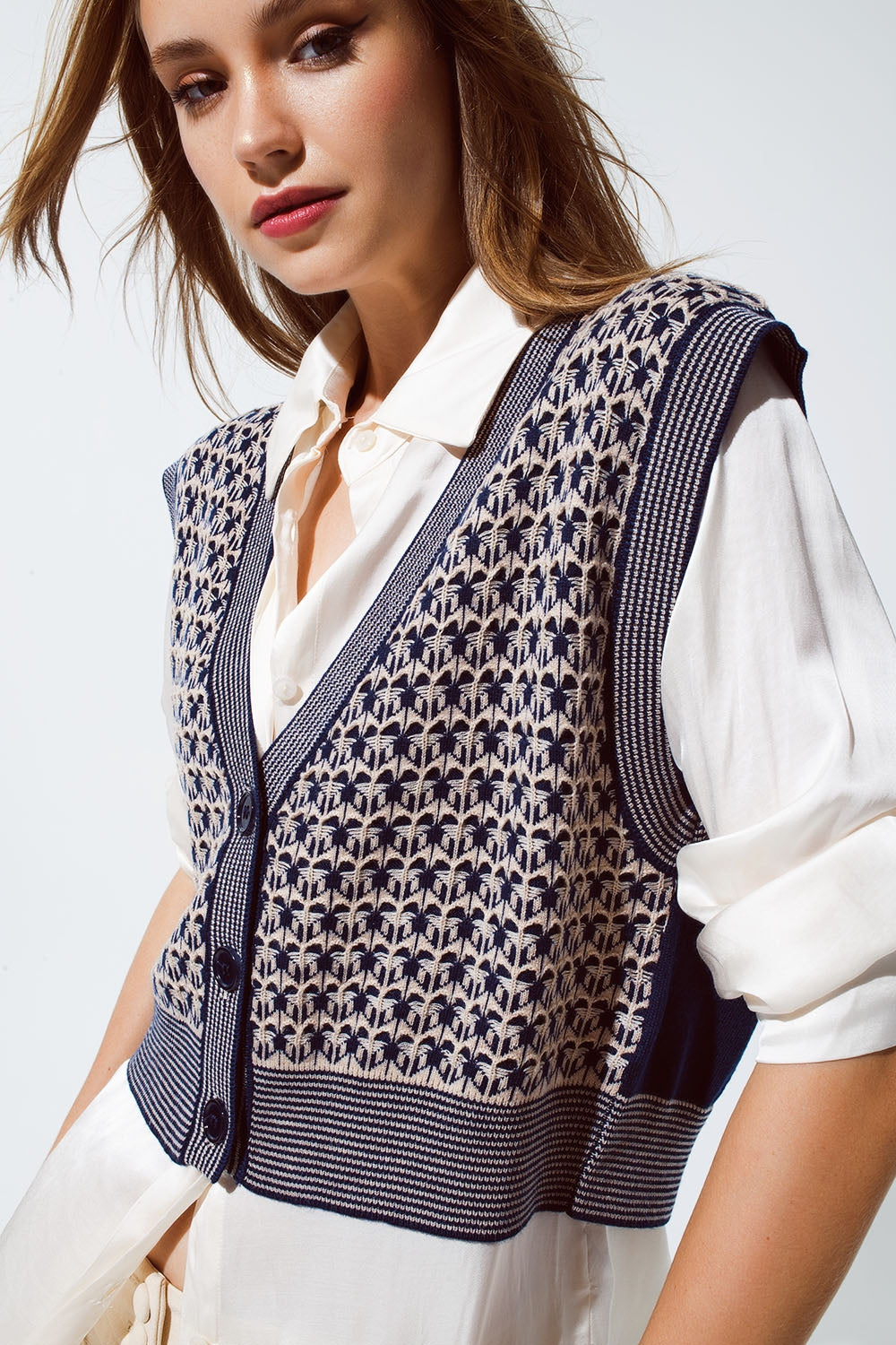 Gilet cropped in maglia con bordo a coste in blu