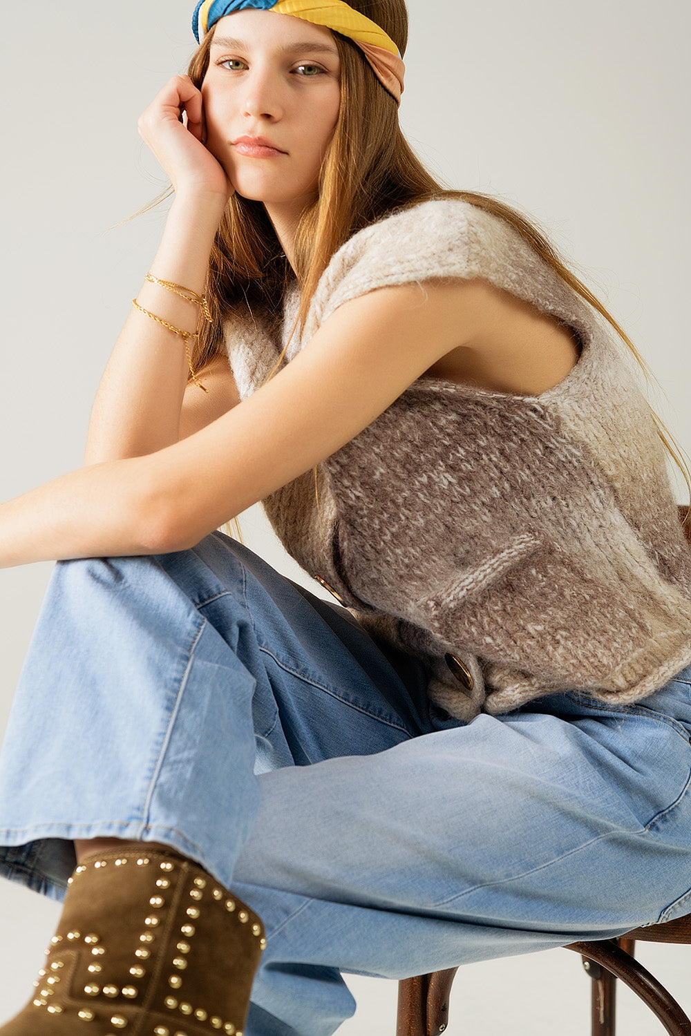 Gilet in maglia beige sfumato con bottoni dorati