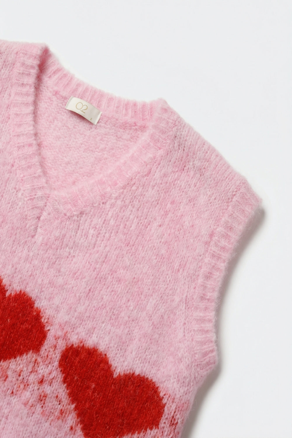 Gilet in maglia rosa vaporosa dalla vestibilitˆ rilassata con motivo a cuore
