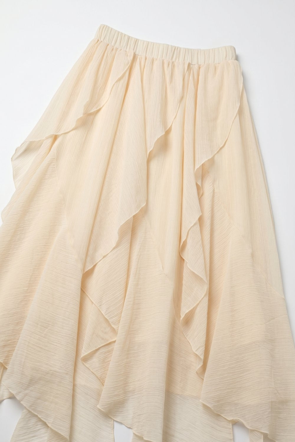 Gonna lunga asimmetrica in chiffon leggero con volant colore beige