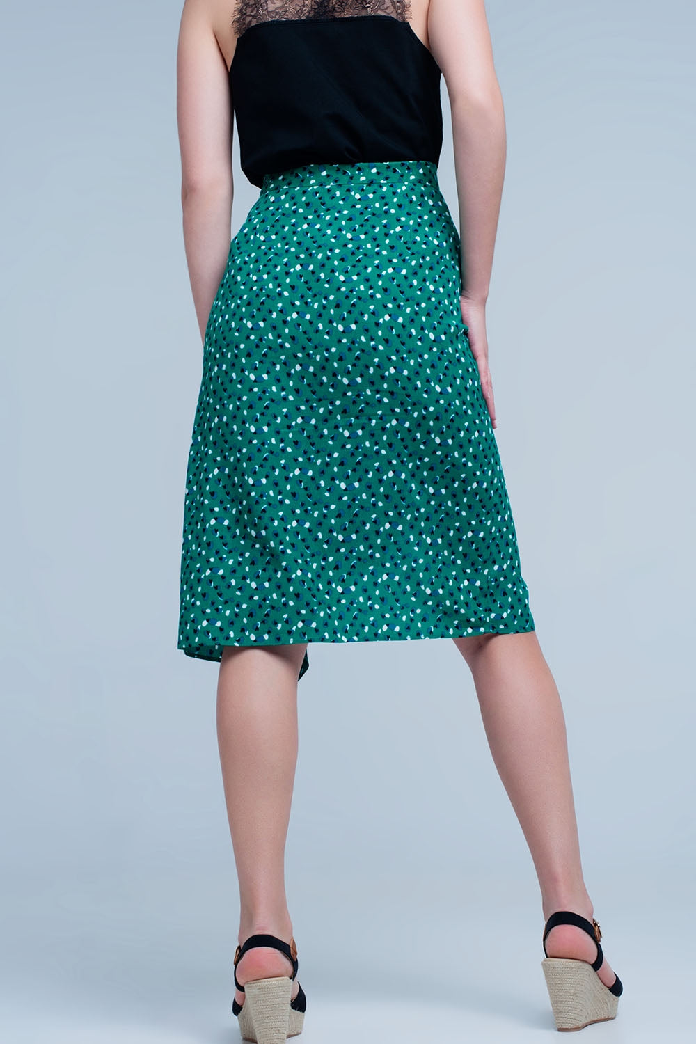 Gonna midi verde con volant e stampa a pois