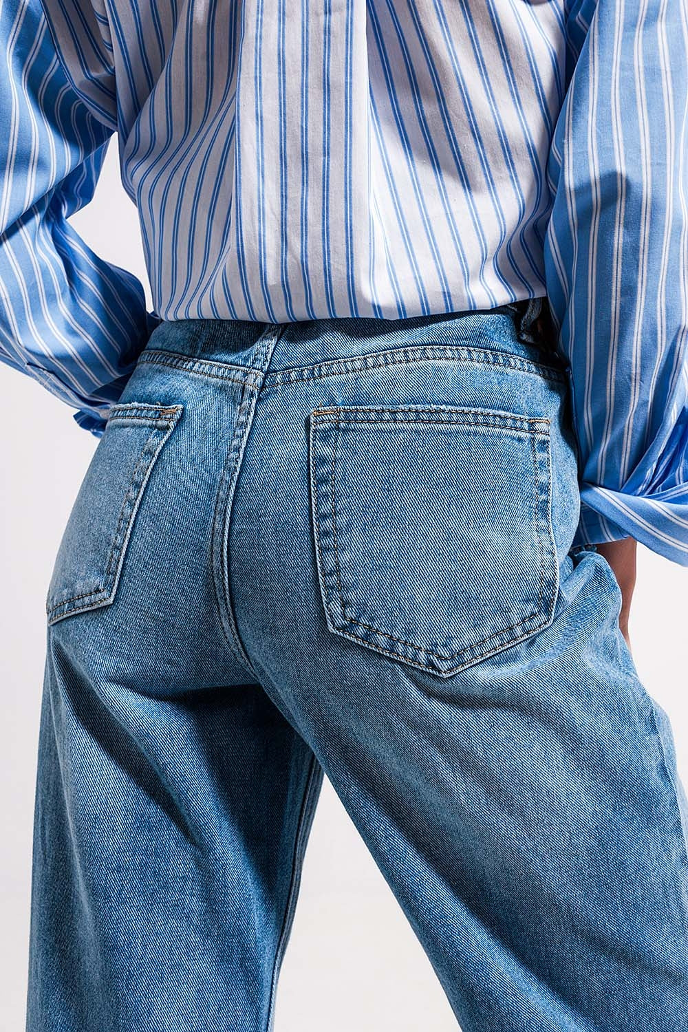 Jeans a vita alta con spacco sul fondo lavaggio vintage