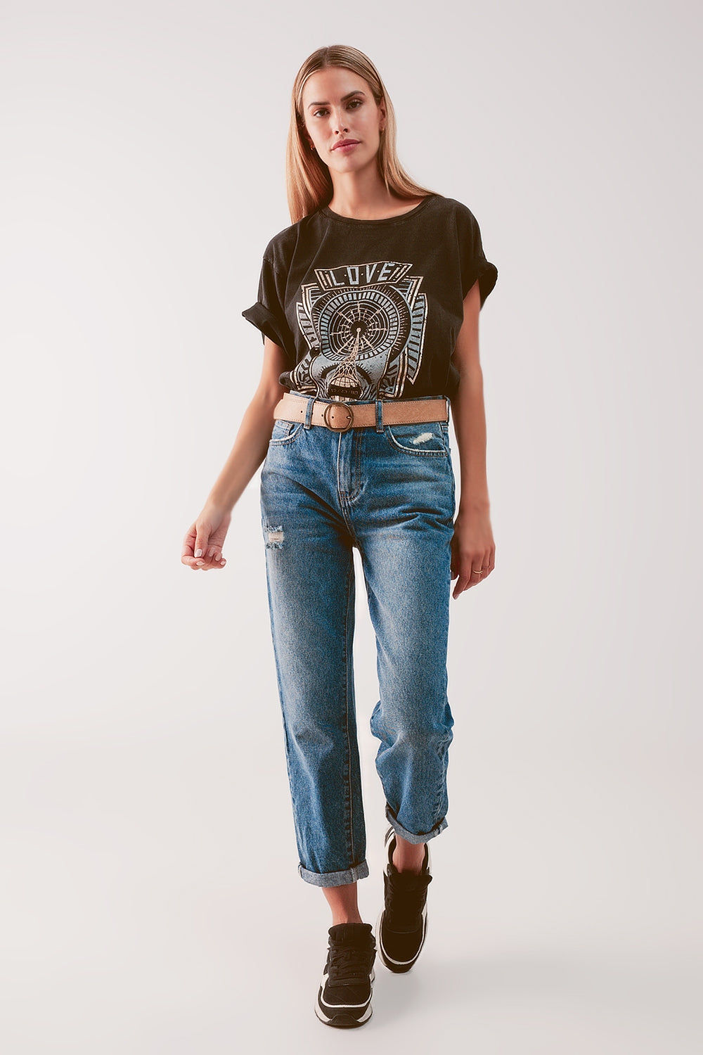 Jeans a vita alta con strappo in blu medio