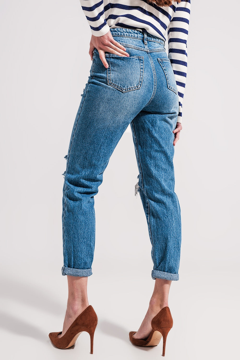 Jeans blu medio con abbottonatura asimmetrica