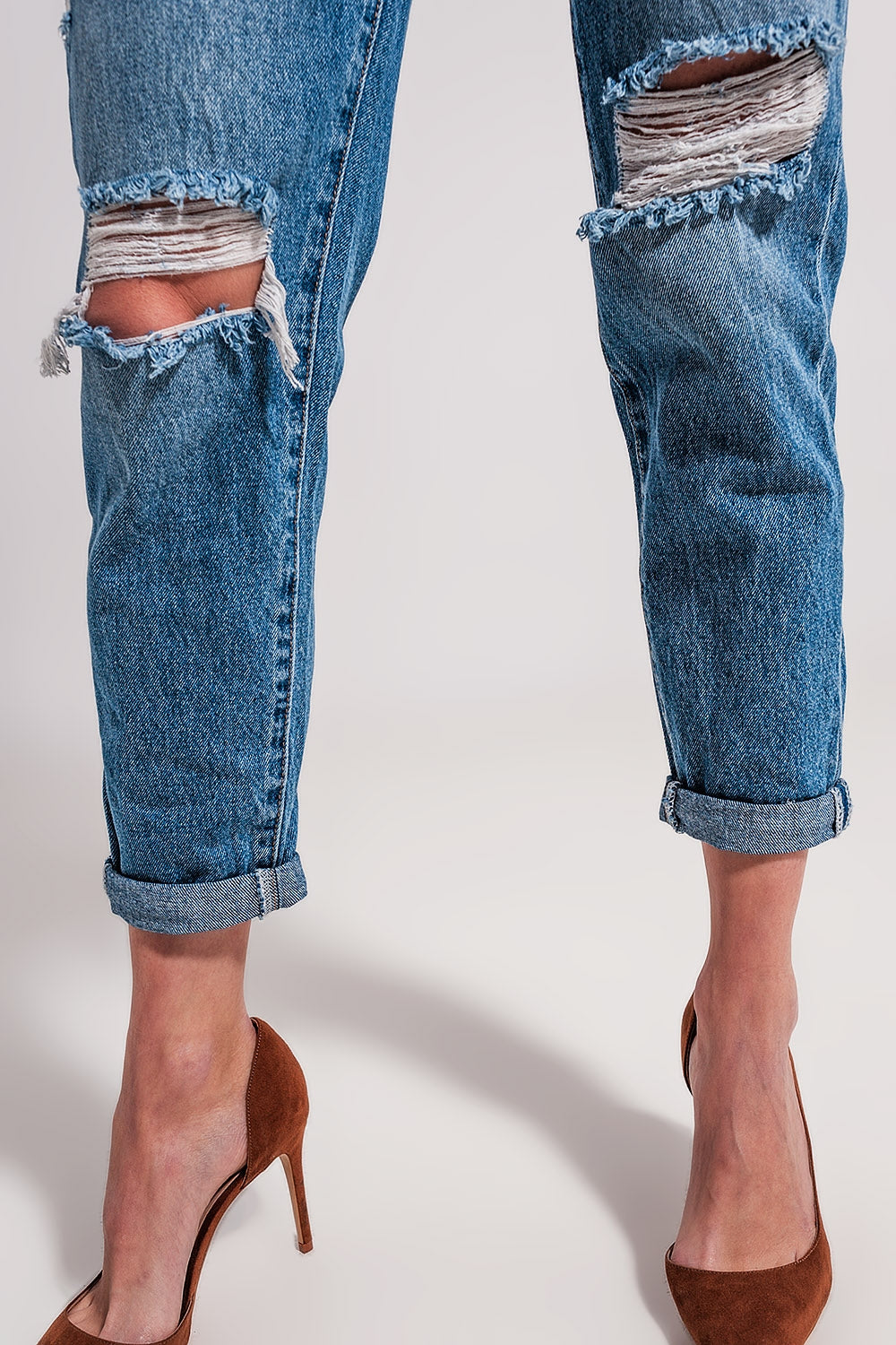 Jeans blu medio con abbottonatura asimmetrica