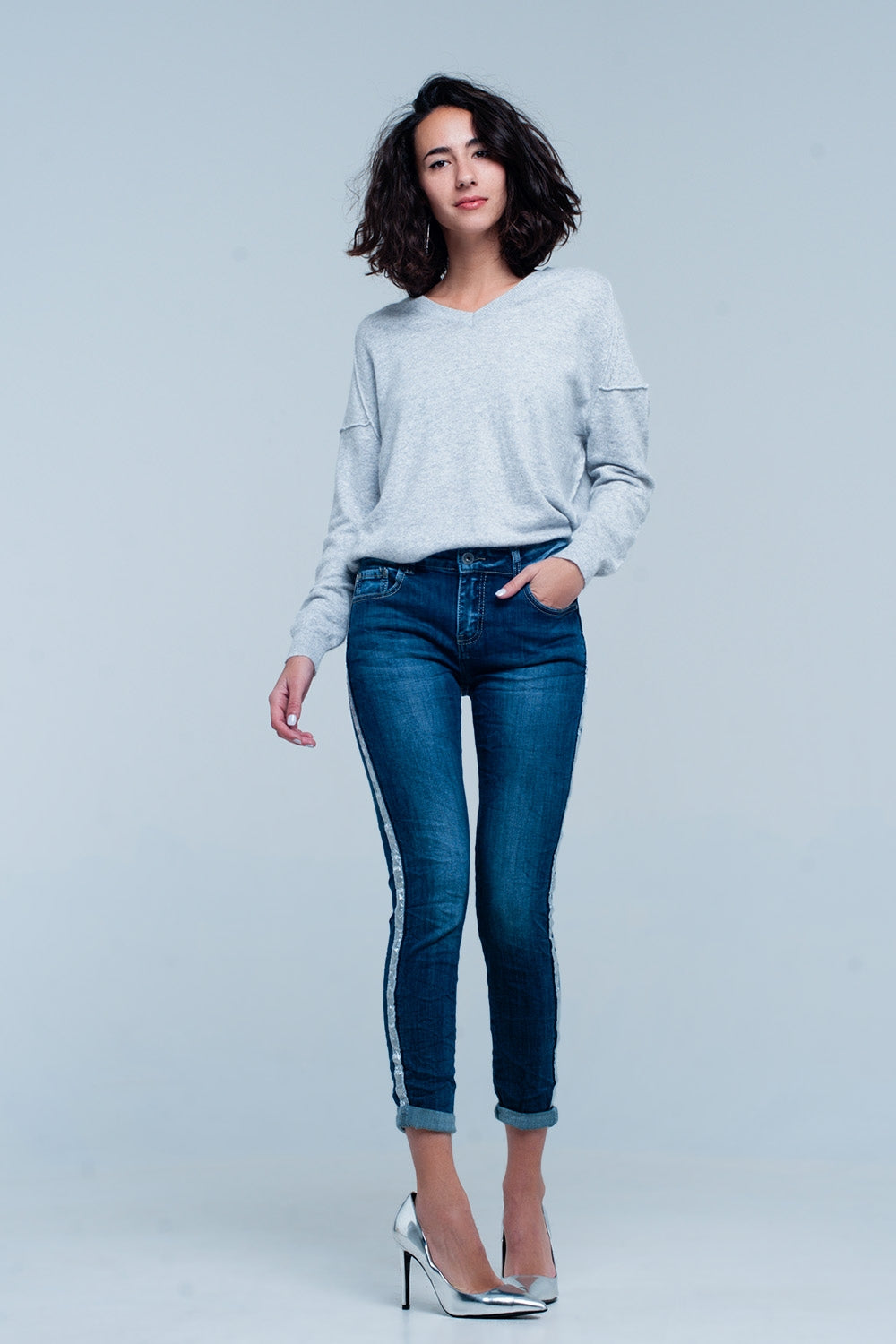 Jeans lavato oscuro con striscia laterale lucida argento