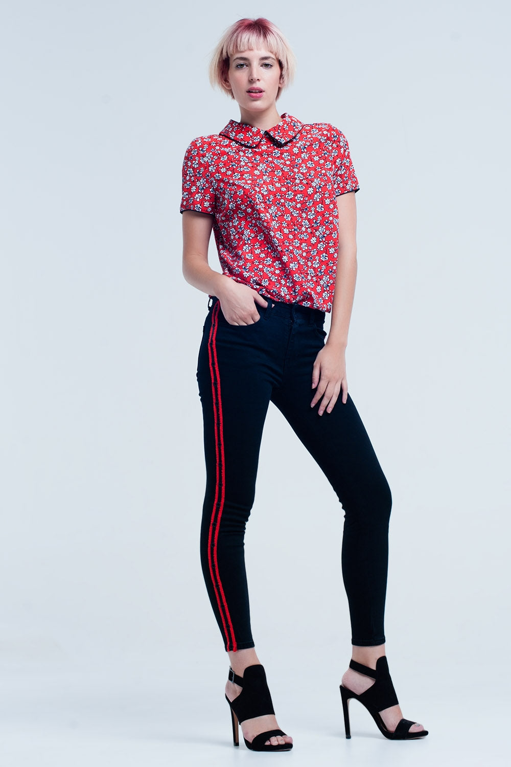 Jeans neri super skinny con occhielli laterali