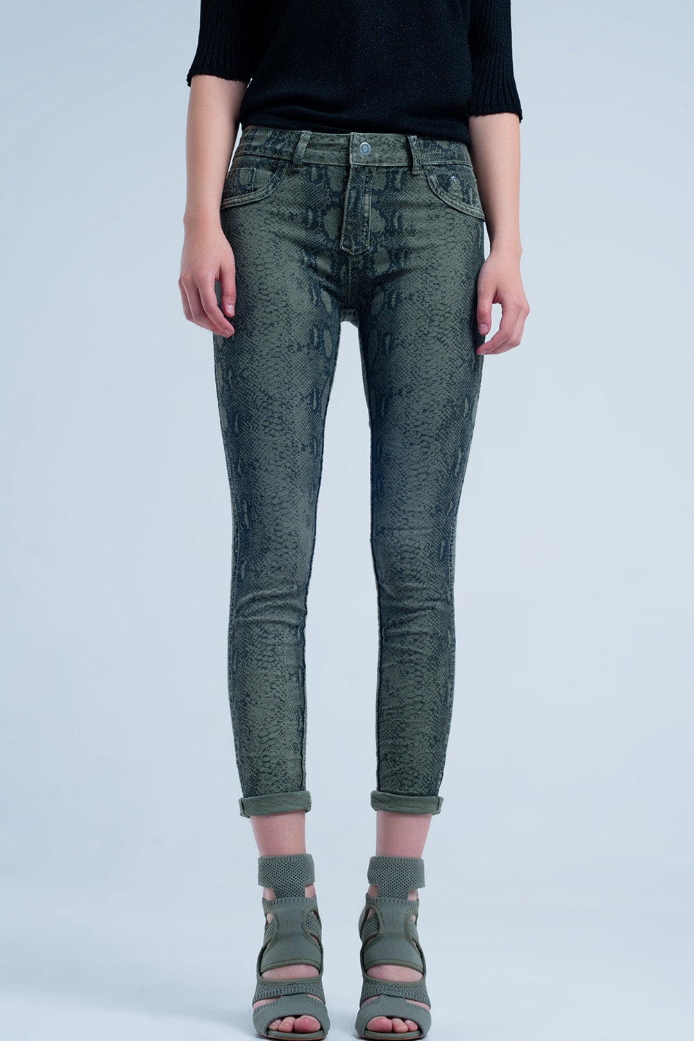Jeans reversibile verdi con stampa a serpente
