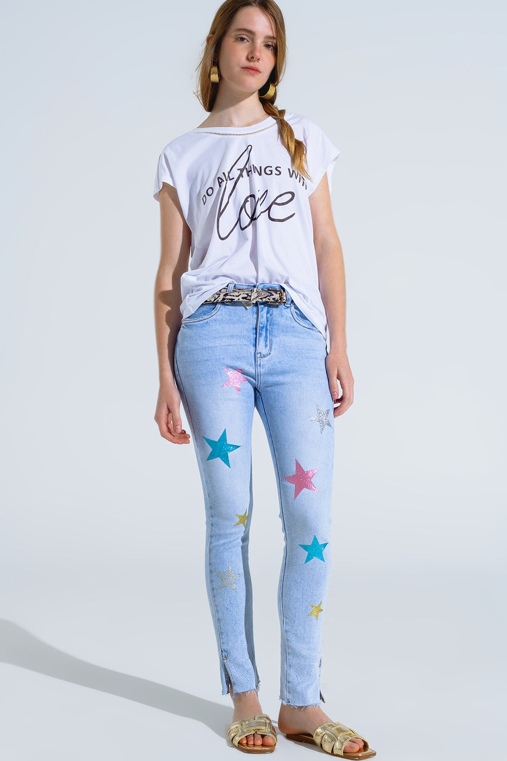 Jeans skinny a lavaggio chiaro con stelle sulle gambe