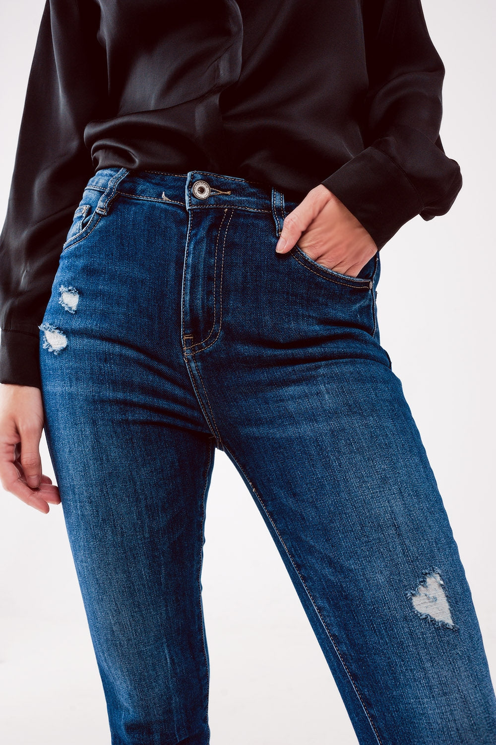 Jeans skinny a vita alta blu lavaggio medio con strappi