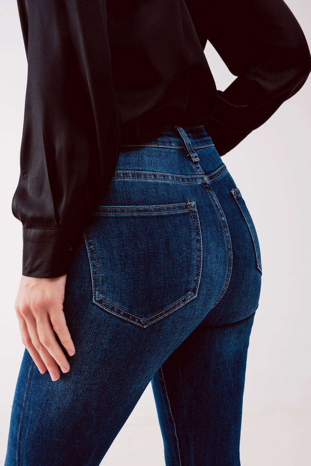 Jeans skinny a vita alta blu lavaggio medio con strappi