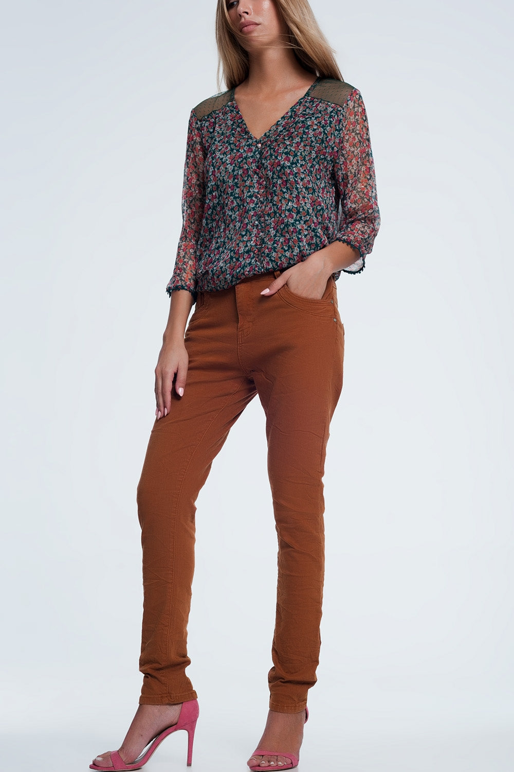 Jeans skinny arancione con cavallo basso