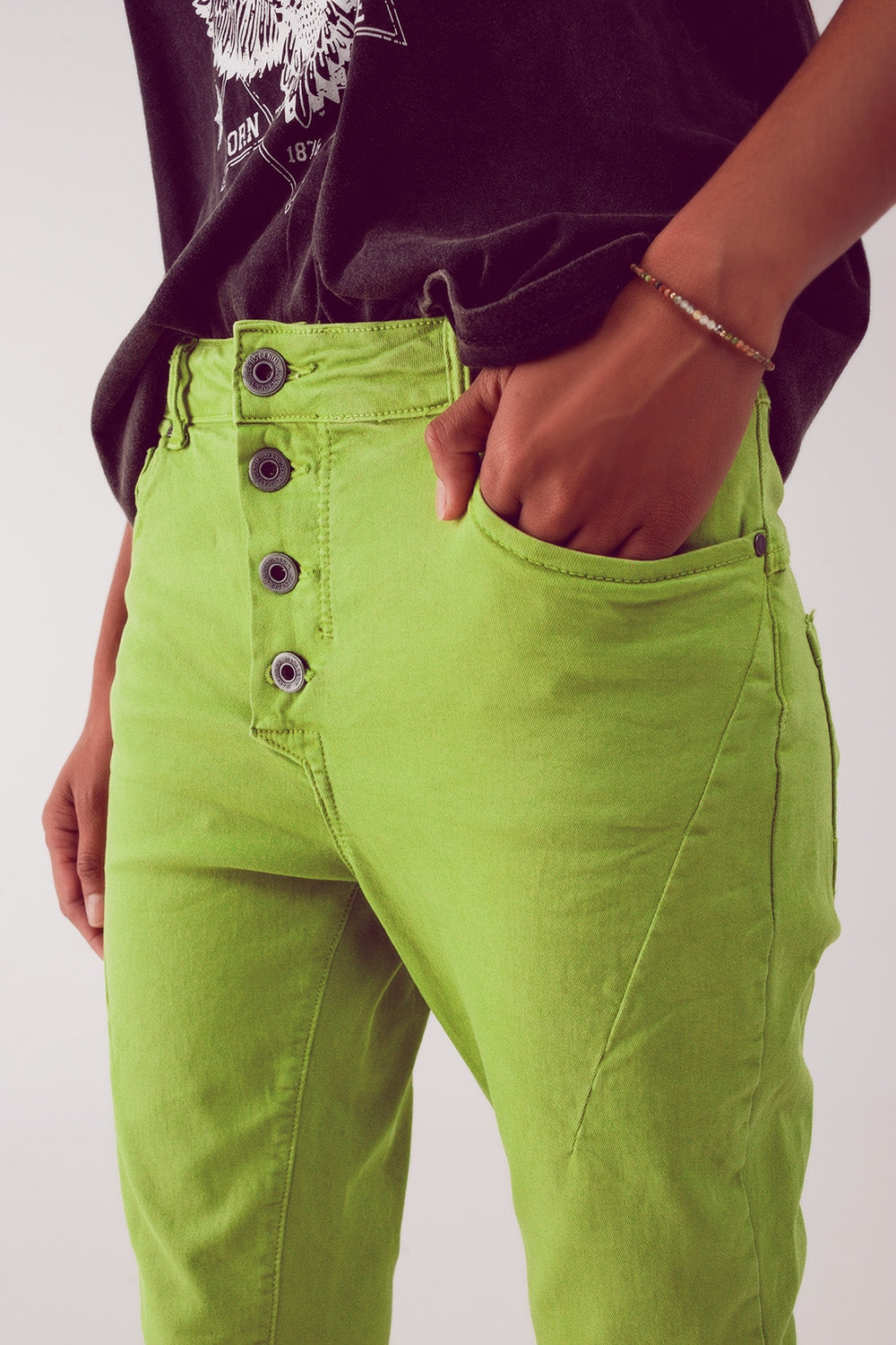 Jeans skinny con bottoni a vista e lavaggio verde
