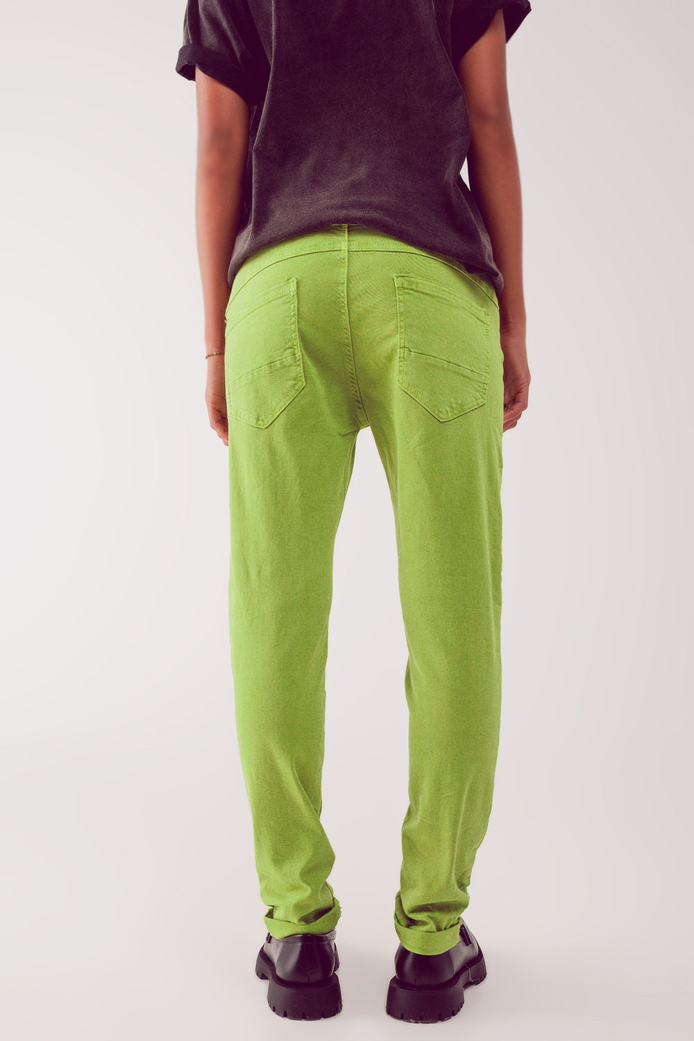 Jeans skinny con bottoni a vista e lavaggio verde