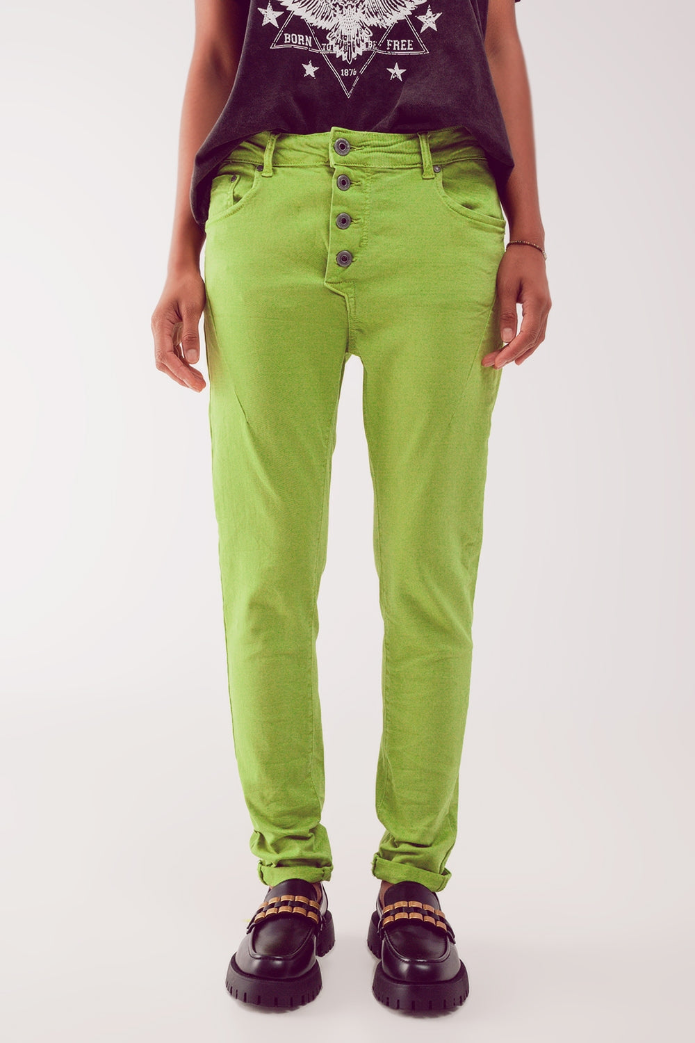 Jeans skinny con bottoni a vista e lavaggio verde