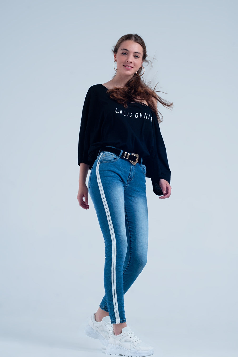 Jeans skinny con fettuccia lungo la cucitura laterale