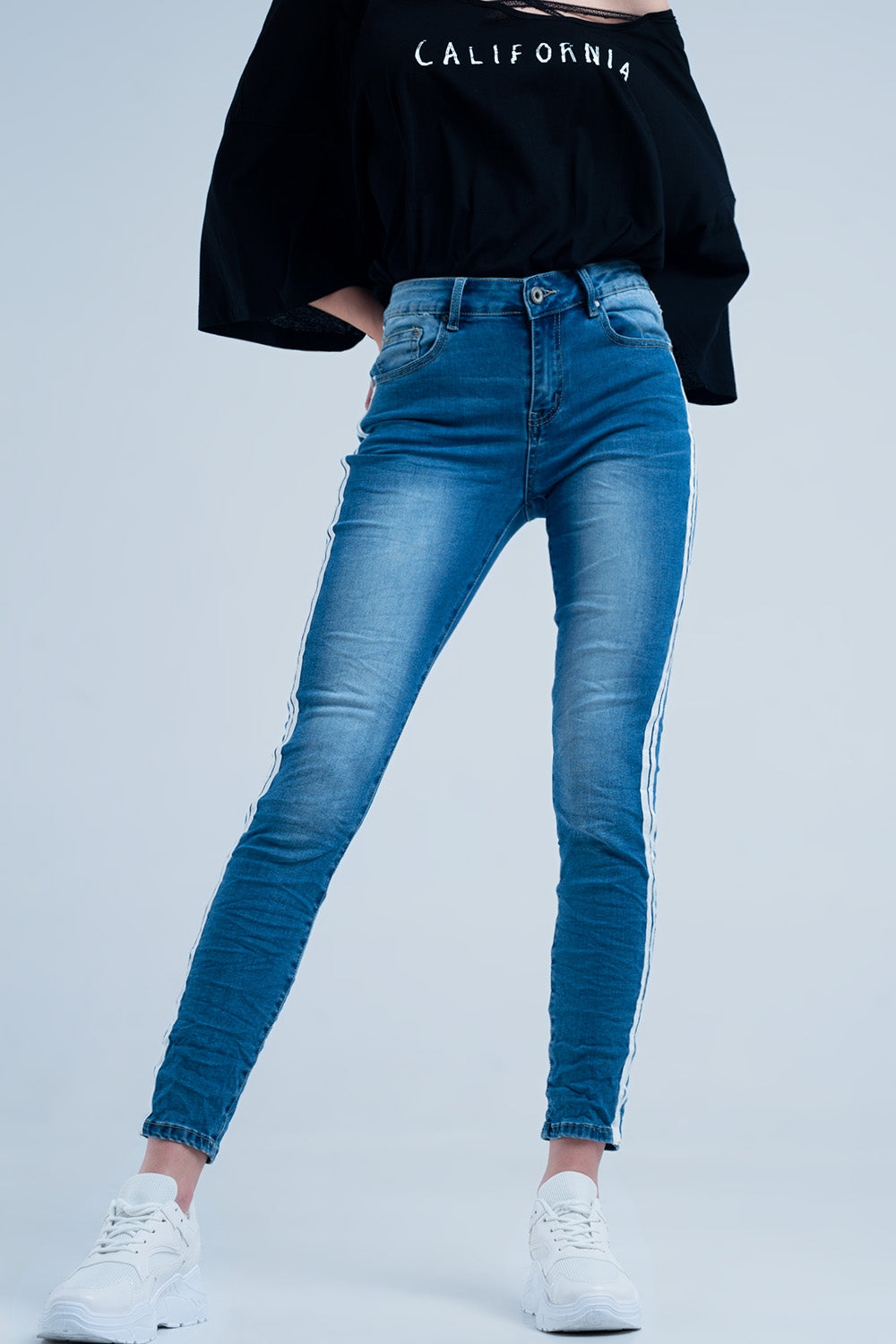 Jeans skinny con fettuccia lungo la cucitura laterale