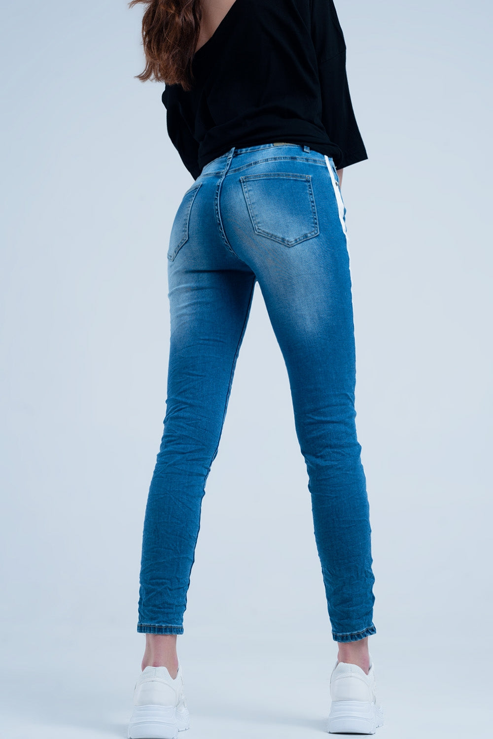 Jeans skinny con fettuccia lungo la cucitura laterale