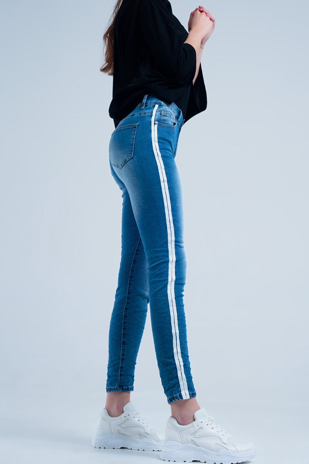 Jeans skinny con fettuccia lungo la cucitura laterale