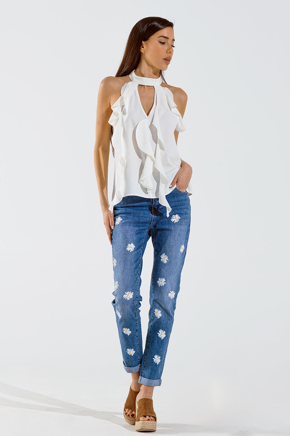 Jeans skinny con margherite bianche stampate in lavaggio medio