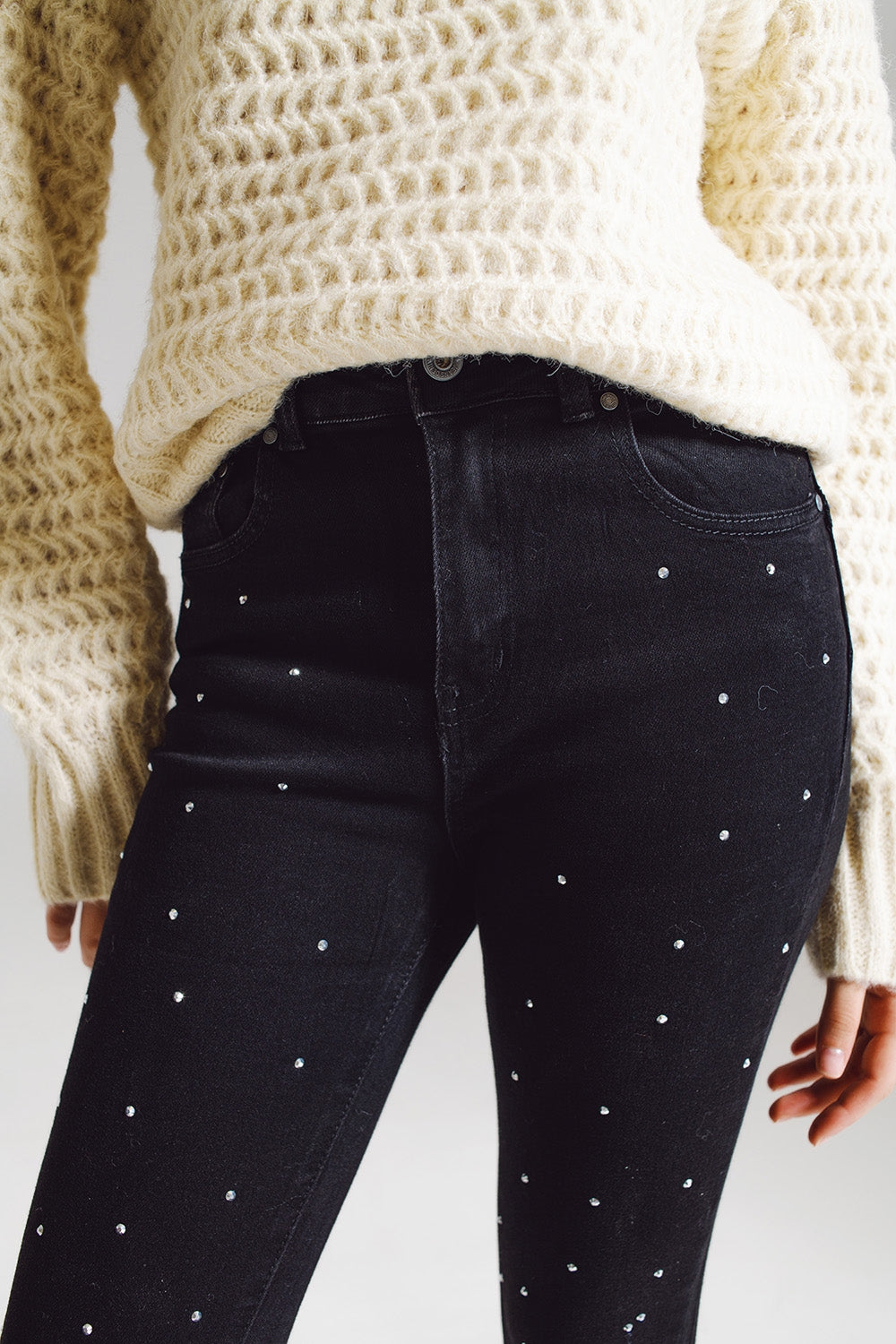 Jeans skinny con strass ricamati su tutto in nero