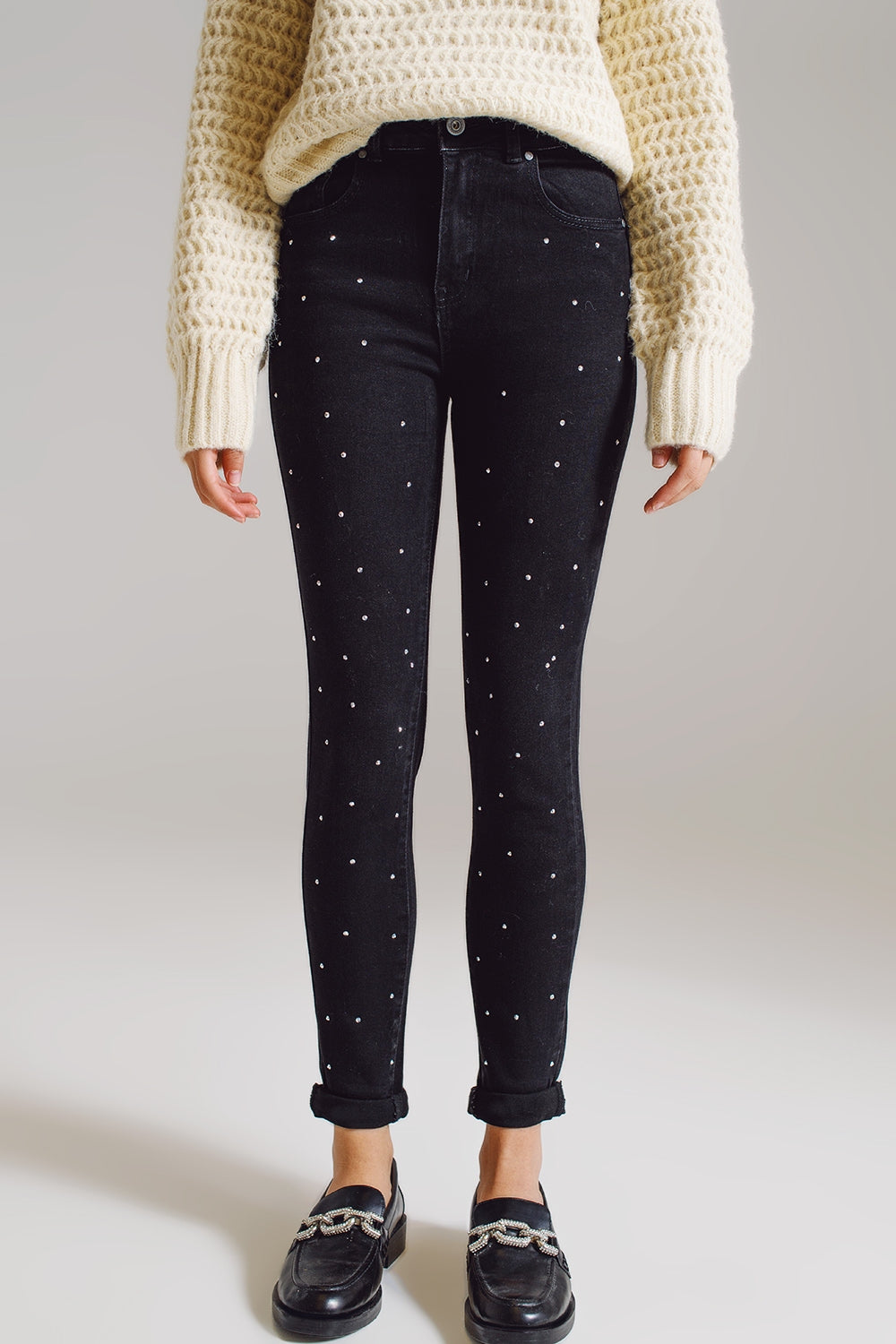 Jeans skinny con strass ricamati su tutto in nero