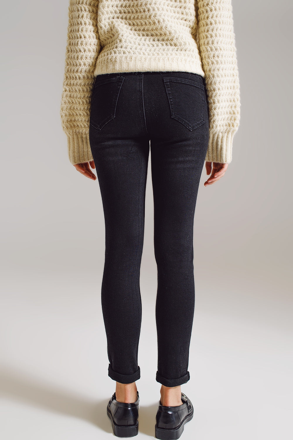 Jeans skinny con strass ricamati su tutto in nero