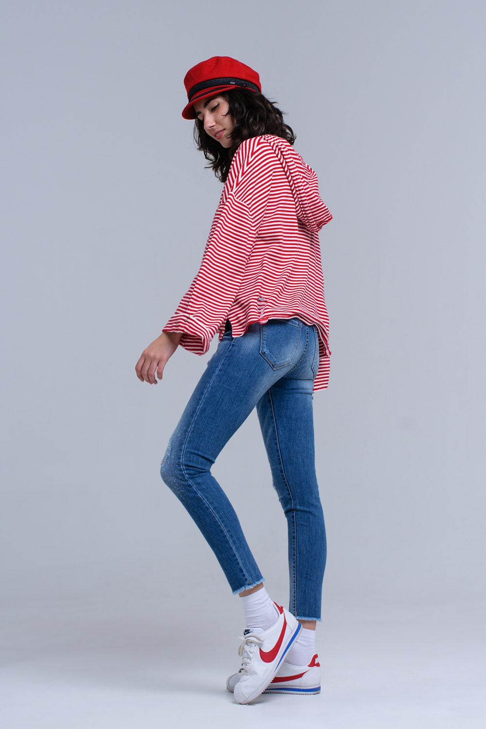 Jeans skinny effetto consumato con frange