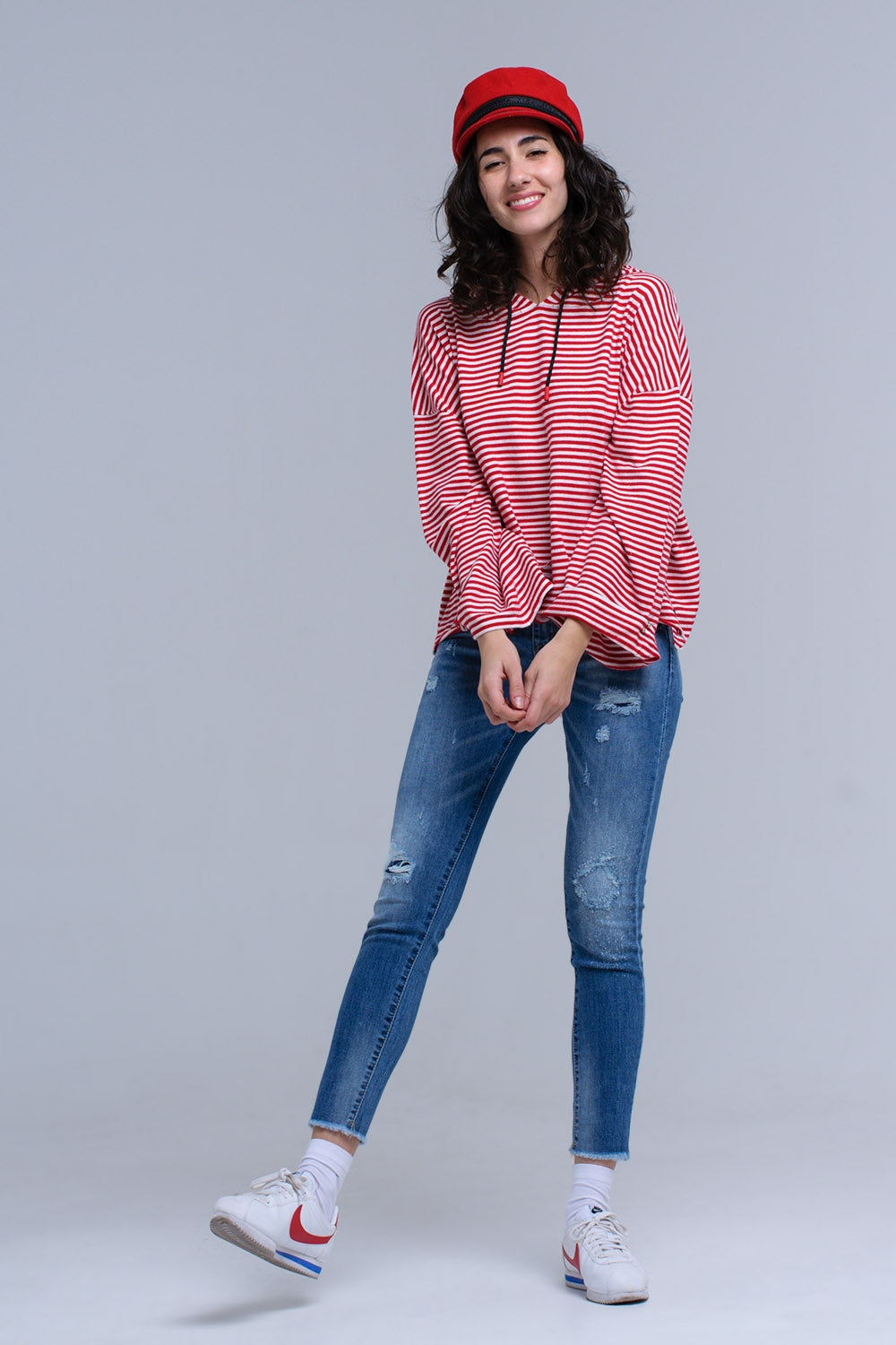 Jeans skinny effetto consumato con frange