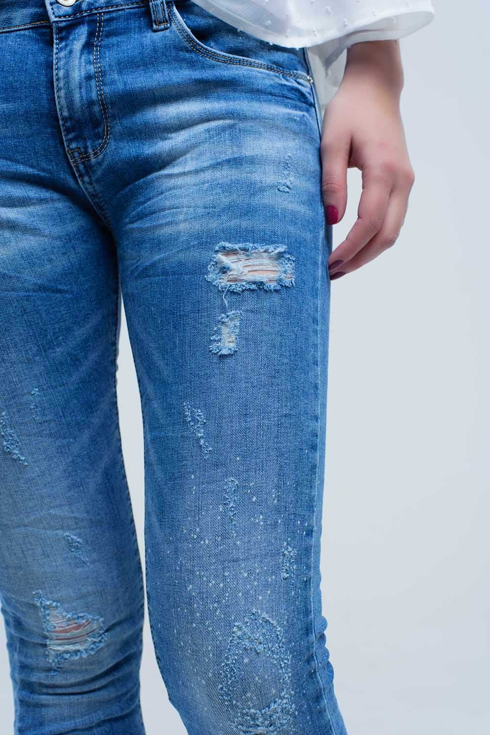 Jeans skinny in lavaggio medio con strappi