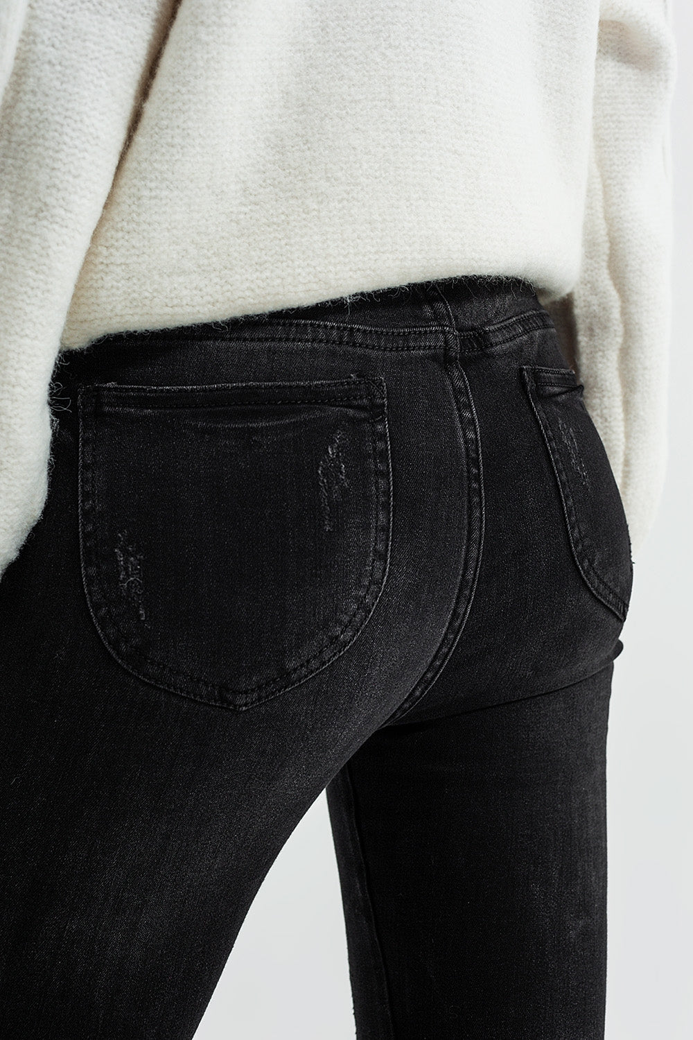 Jeans skinny lavaggio nero con zip sulla caviglia