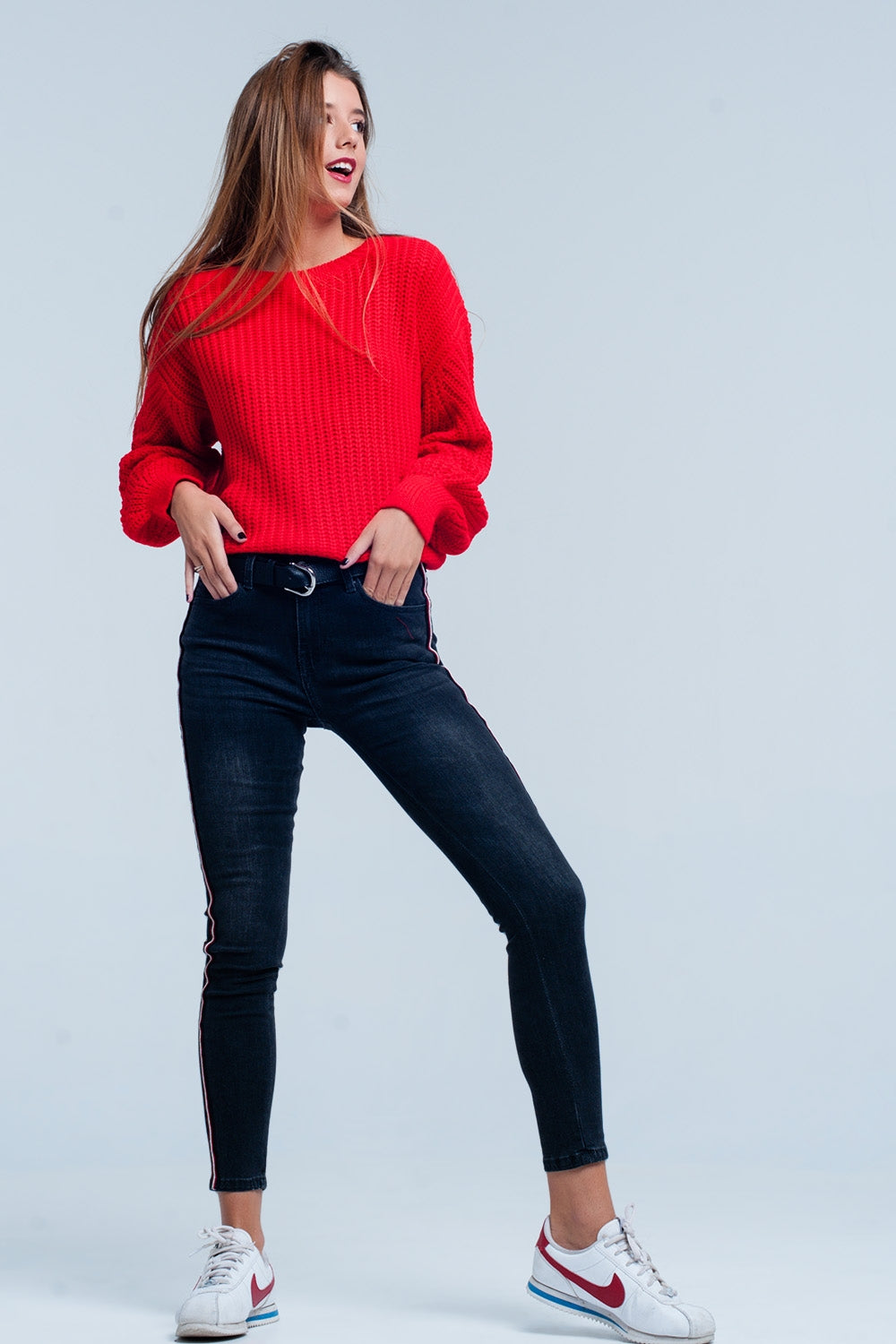 Jeans skinny neri con banda laterale rosso