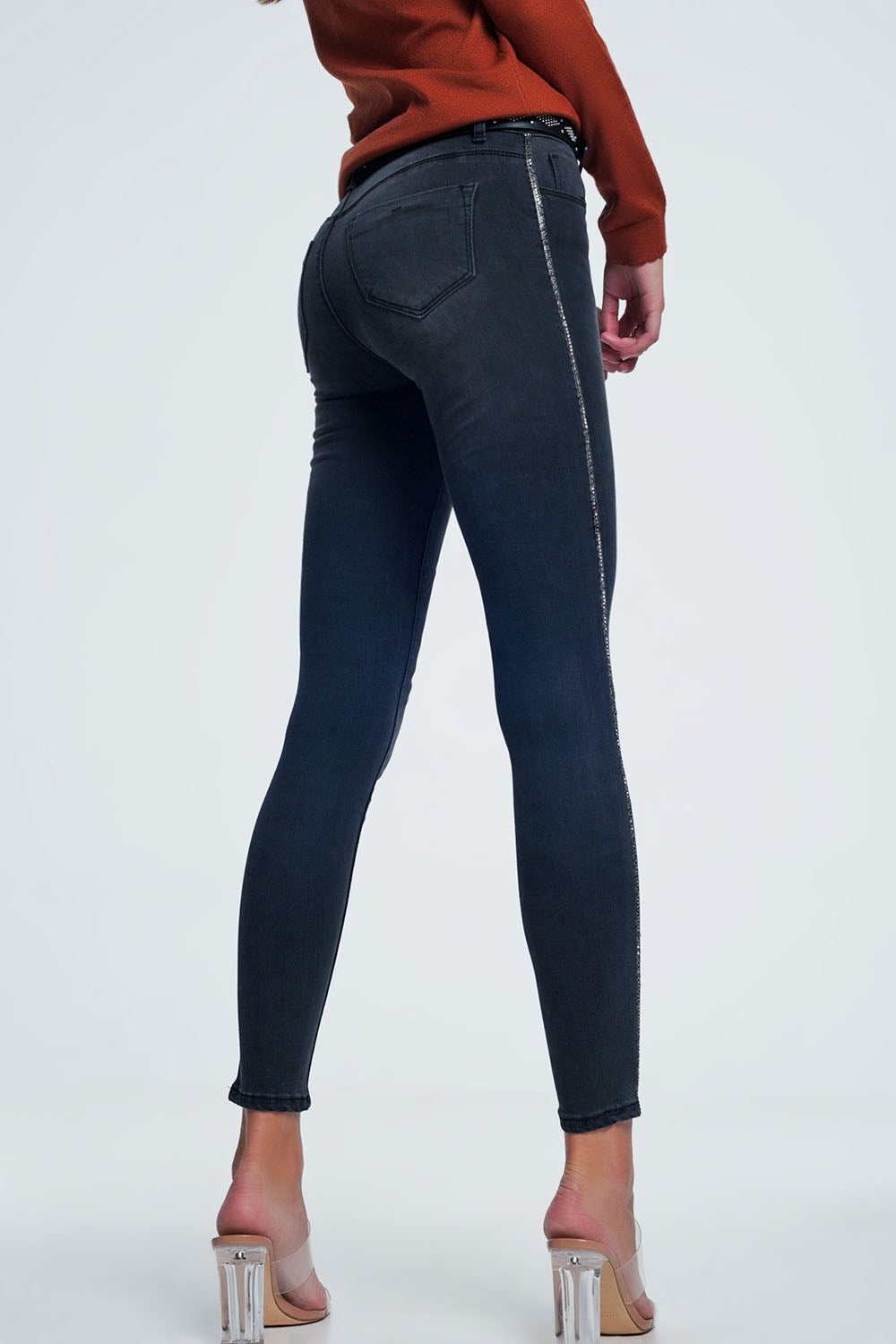Jeans skinny neri con decorazione laterale
