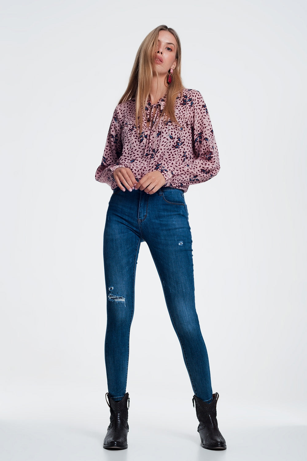 Jeans skinny strappati blu
