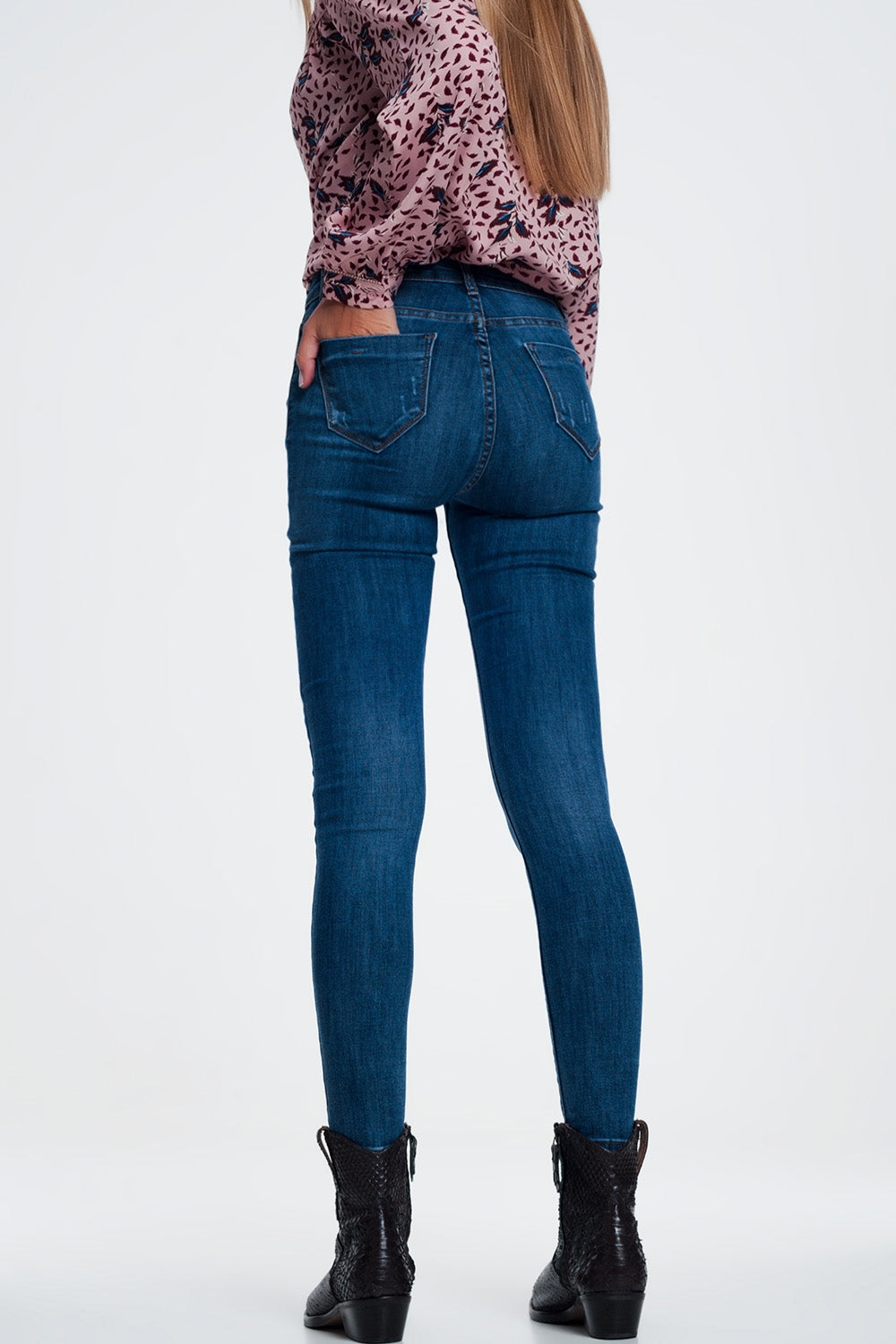 Jeans skinny strappati blu