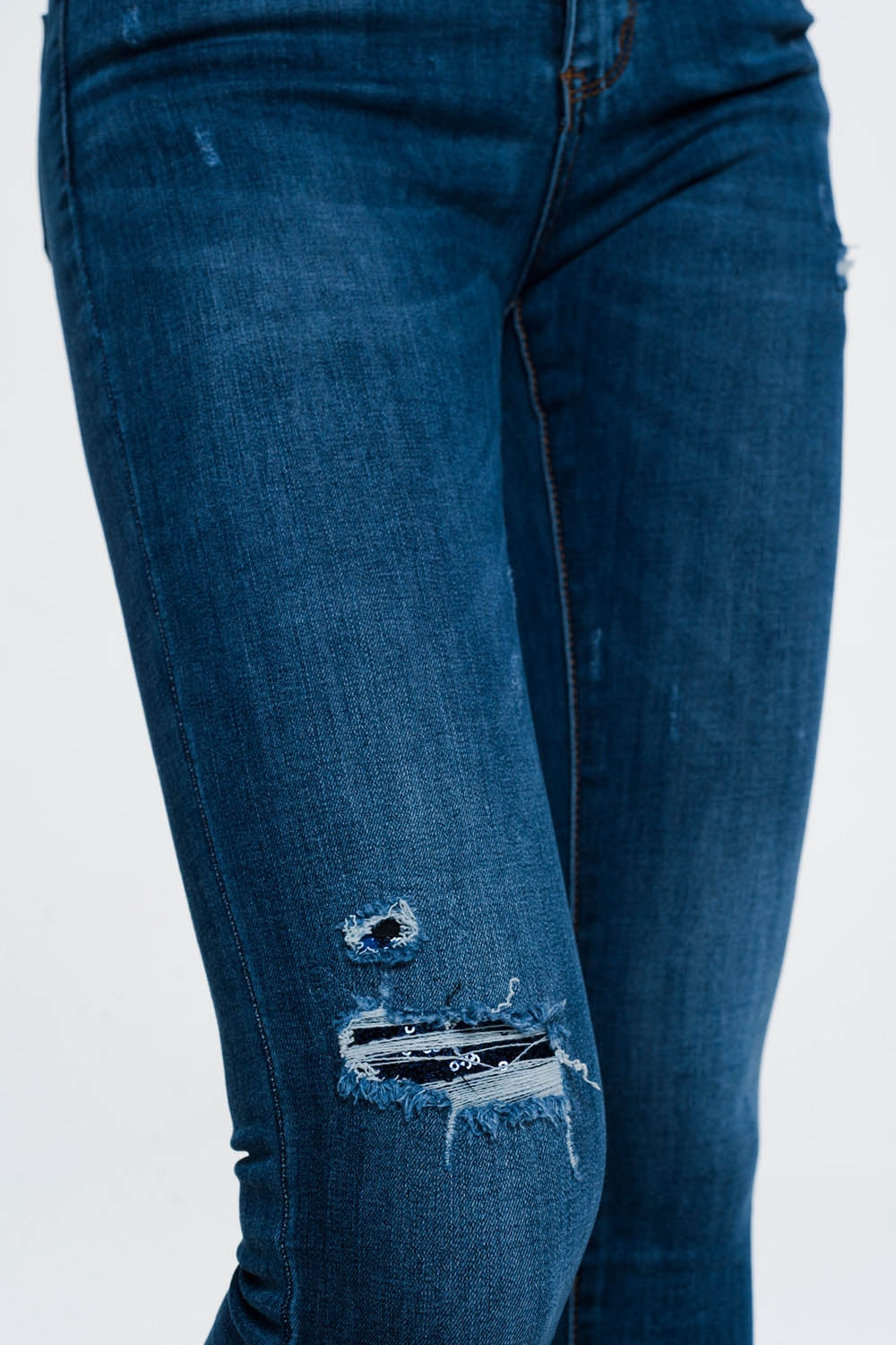 Jeans skinny strappati blu